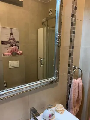 a bathroom with a sink and a mirror at Apartment Sweet Home Banja Luka in Banja Luka