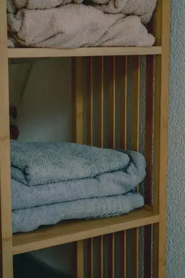a bunch of towels are sitting on a shelf at Villa Tasnim in Dobrenica
