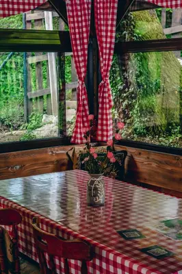 a table with a red and white checkered table cloth at Villa Tasnim in Dobrenica