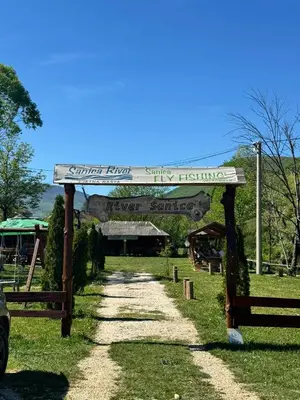 a sign for a entry to a country music festival at Bungalow Fly Fishing Kljuc River Sanica in Zolaći
