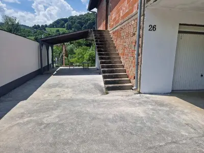 a brick building with a set of stairs on the side at Apartman Sofija in Banja Luka