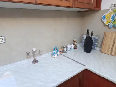a kitchen counter with a white counter top at Sunshine Apartments Visoko in Visoko