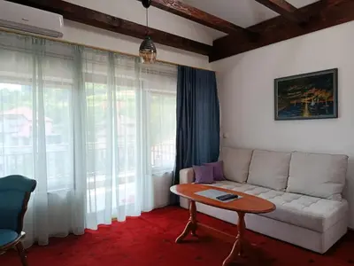 a living room with a couch and a table at Sunshine Apartments Visoko in Visoko