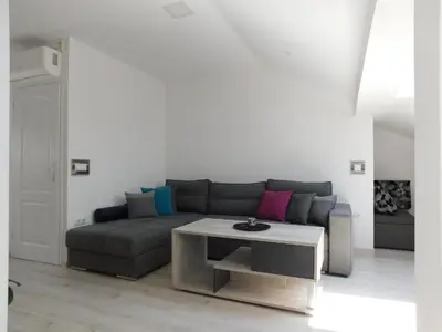 a living room with a couch and a coffee table at Tina apartman in Prnjavor