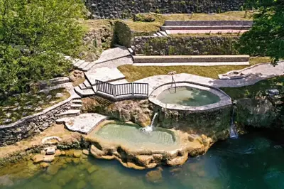an aerial view of a pond with a fountain in the water at Riverside Panorama Apartment 2 near City Center Brko 2 in Banja Luka