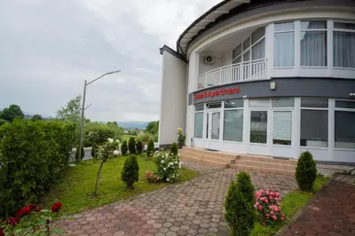 a building with a sign on the side of it at Stan lux Kašmir in Bugojno