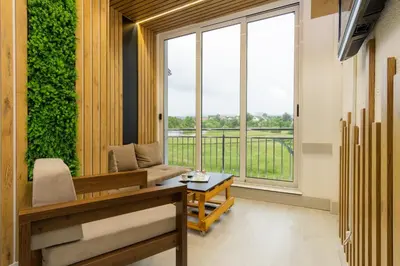 a living room with a couch and a large window at Stan lux Kašmir in Bugojno