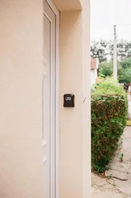 a door with a mailbox on the side of a house at Apartmani Romić R in Novi Travnik