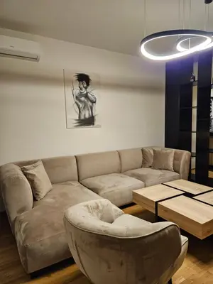 a living room with a couch and a table at ADAV Luxus Apartment in Visoko