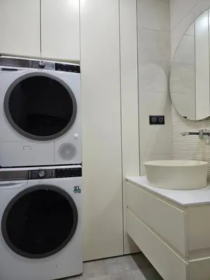 a kitchen with a washing machine and a sink at ADAV Luxus Apartment in Visoko