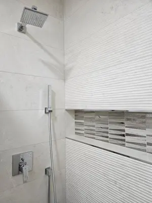 a shower in a bathroom with a shower curtain at ADAV Luxus Apartment in Visoko