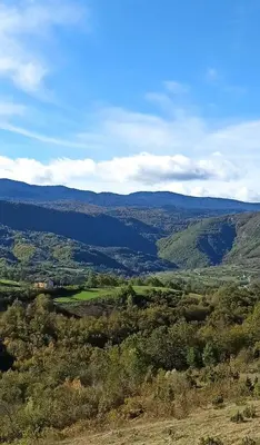 a view of a valley with mountains in the distance at Vila Brdjanka in Šipovo