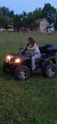 a woman sitting on a atv in a field at Vila Brdjanka in Šipovo