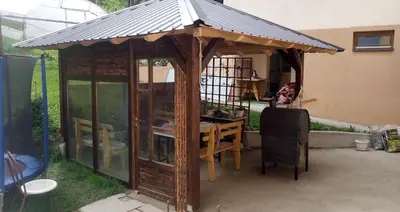 a wooden gazebo with a roof on top of it at Guest House Visoko in Visoko