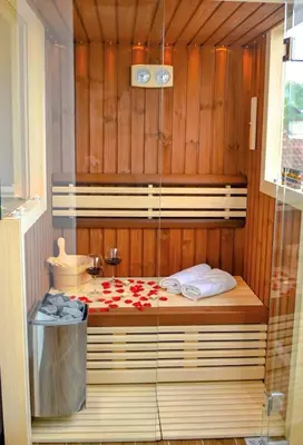 a bed in a room with a glass wall at Platinum_Luxury_Apartment II in Teslić