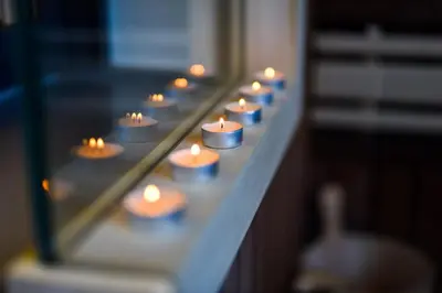 a bunch of candles are sitting on a shelf at Platinum_Luxury_Apartment II in Teslić