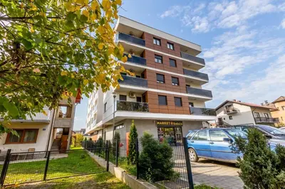 a building with a car parked in front of it at Platinum_Luxury_Apartment II in Teslić