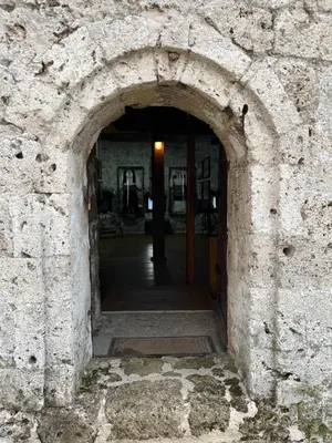 an archway in a stone wall in a building at Apartman My Choice in Bihać