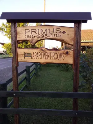 a sign for the entrance to a park with a fence at Apartmani Primus in Bosanska Gradiška