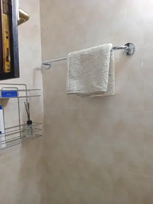 a towel hanging on a towel rack in a bathroom at Apartmani Primus in Bosanska Gradiška