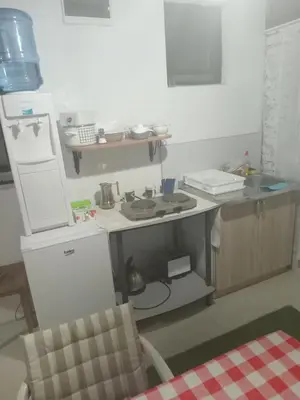 a small kitchen with a sink and a stove at Apartmani Primus in Bosanska Gradiška