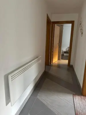 a room with a hallway with a door and a tile floor at Apartment Riverstone Retreat in Jajce