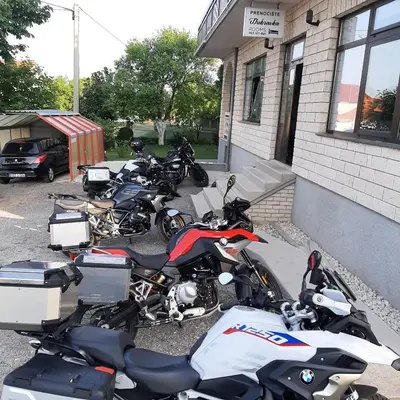 a group of motorcycles parked outside of a building at Prenoćište Dubravka in Livno