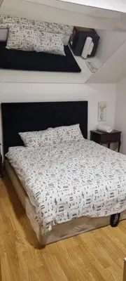 a bedroom with a bed with a sheet with music at Rok in Tešanj