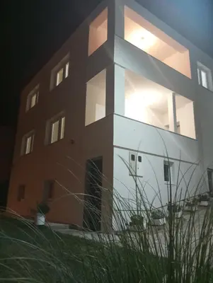 a large building with an rv in front of it at Apartmani Mušinbegović1 in Visoko