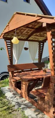 a wooden picnic table in a pavilion at Vareš in Vareš
