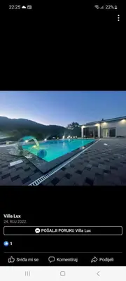 a television screen with a picture of a swimming pool at Villa Lux in Bosanska Krupa