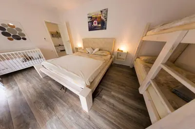 a bedroom with two bunk beds in a room at Villa Bubinka in Bihać