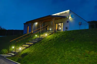 a house on a hill with lights on it at Villa Bubinka in Bihać