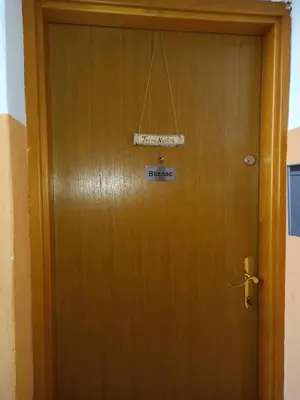 a wooden door with a sign on it at TerraNostra in Jajce