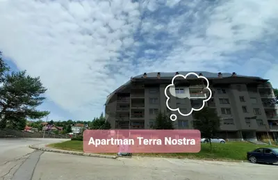 a sign in front of a building at TerraNostra in Jajce