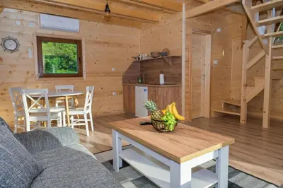 a living room with a couch and a table at Bungalow Jajce 1 in Jezero