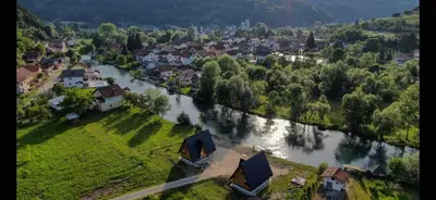 an aerial view of a village with a river at Bungalow Jajce 2 in Jezero