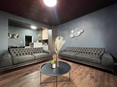 a living room with two couches and a table at Lux apartments Crystal-center in Bihać