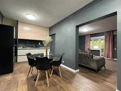 a kitchen and dining room with a table and chairs at Lux apartments Crystal-center in Bihać