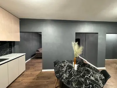 a kitchen with a table with a plant on it at Lux apartments Crystal-center in Bihać