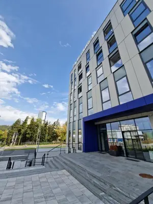 a building with a staircase in front of it at Smart Loft Apartment - connection of city center and luxury in Tuzla