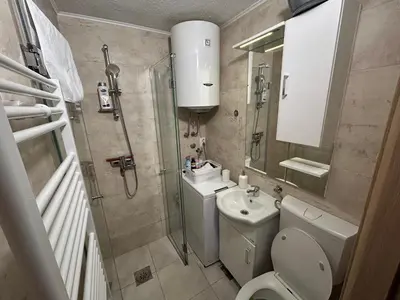 a bathroom with a shower and a toilet and a sink at New apartment - Moon in Banja Luka