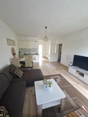 a living room with a couch and a table at Apartman TESA in Sanski most