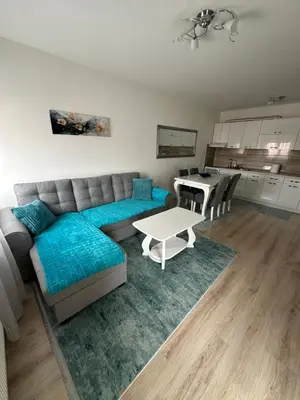 a living room with a couch and a table at Stan na dan Tamaris in Modriča