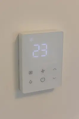 a white lightswitch on a wall in a room at Villa UNA LUX in Bihać
