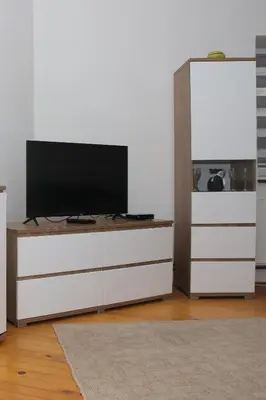 a flat screen tv sitting on top of a white dresser at Ema Apartman in Livno