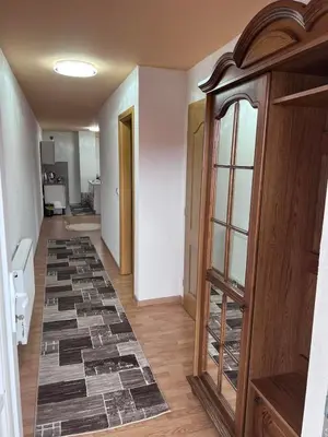 a hallway with a tile floor in a room at Apartman Citadel in Gradačac