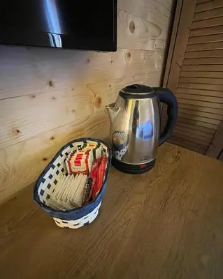a coffee pot and a basket on a table at Etno zona Oaza mira in Donji Vakuf