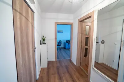 a hallway with a door leading to a living room at Apartman Niko in Livno