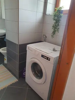 a washing machine in a bathroom with a toilet at OLD HOUSE in Jajce